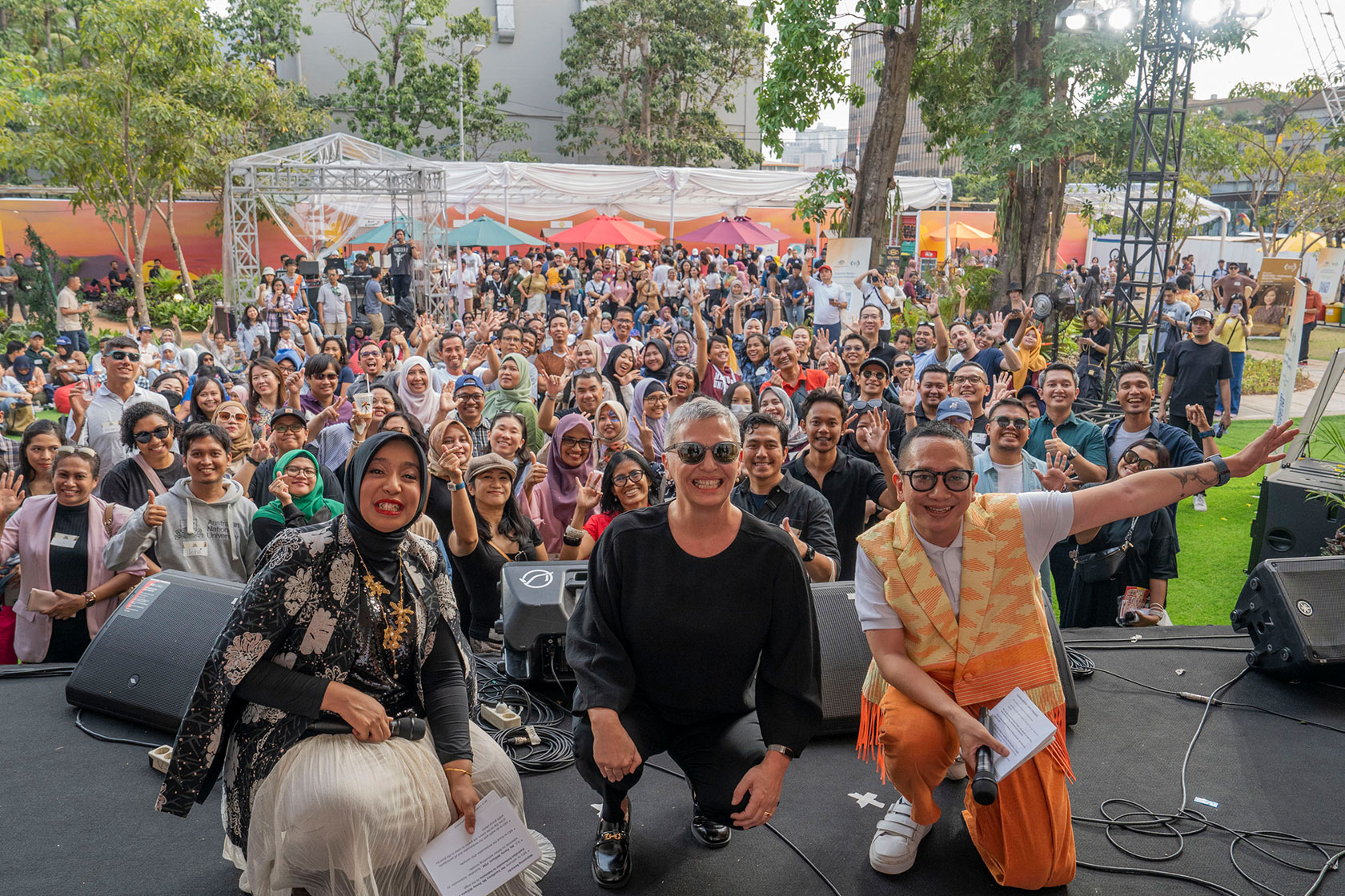 An ensemble photograph featuring Ambassador Penny Williams and all the participants of Gig on the Green