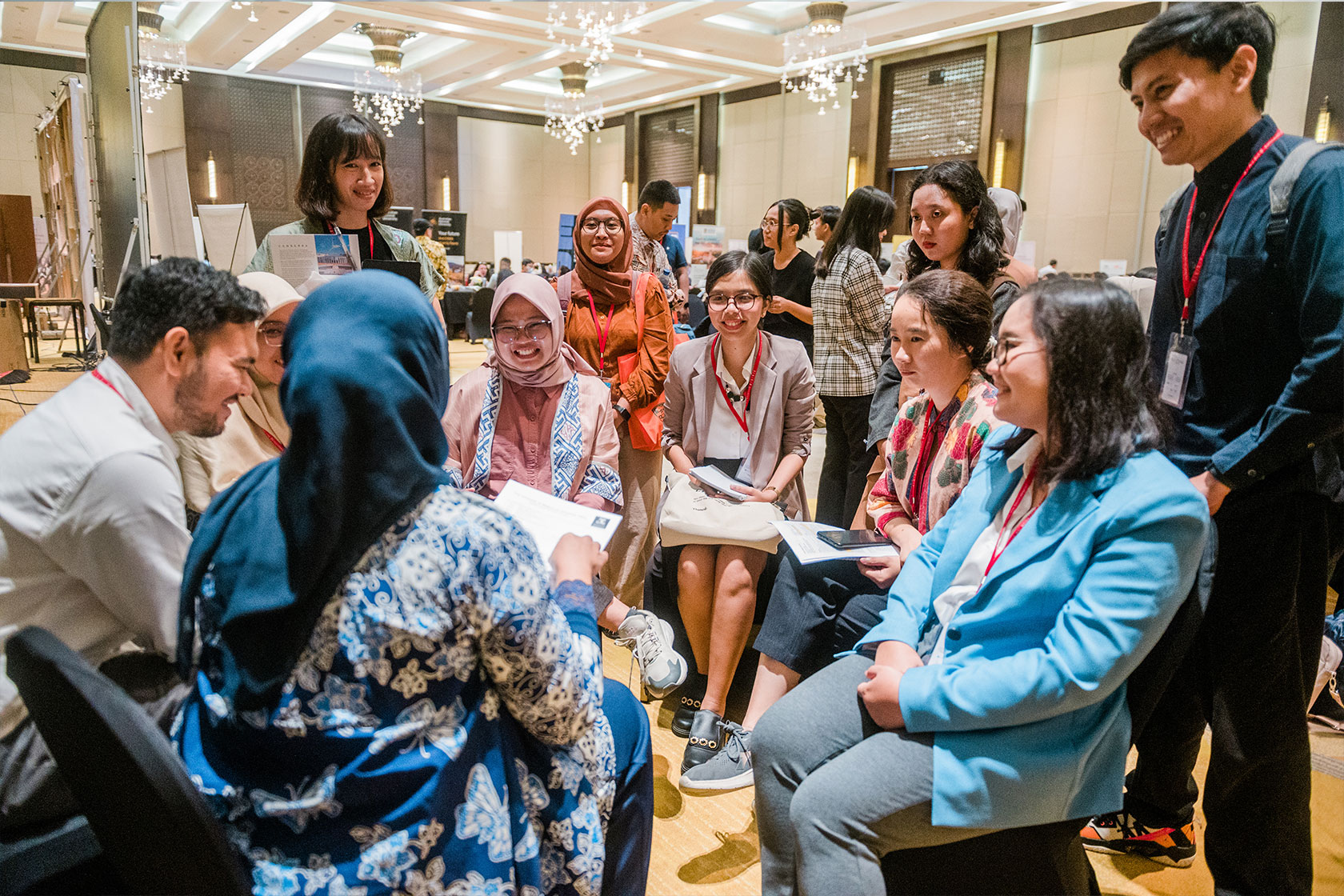 Scholars are engaged in a group consultation with representatives from an Australian university.