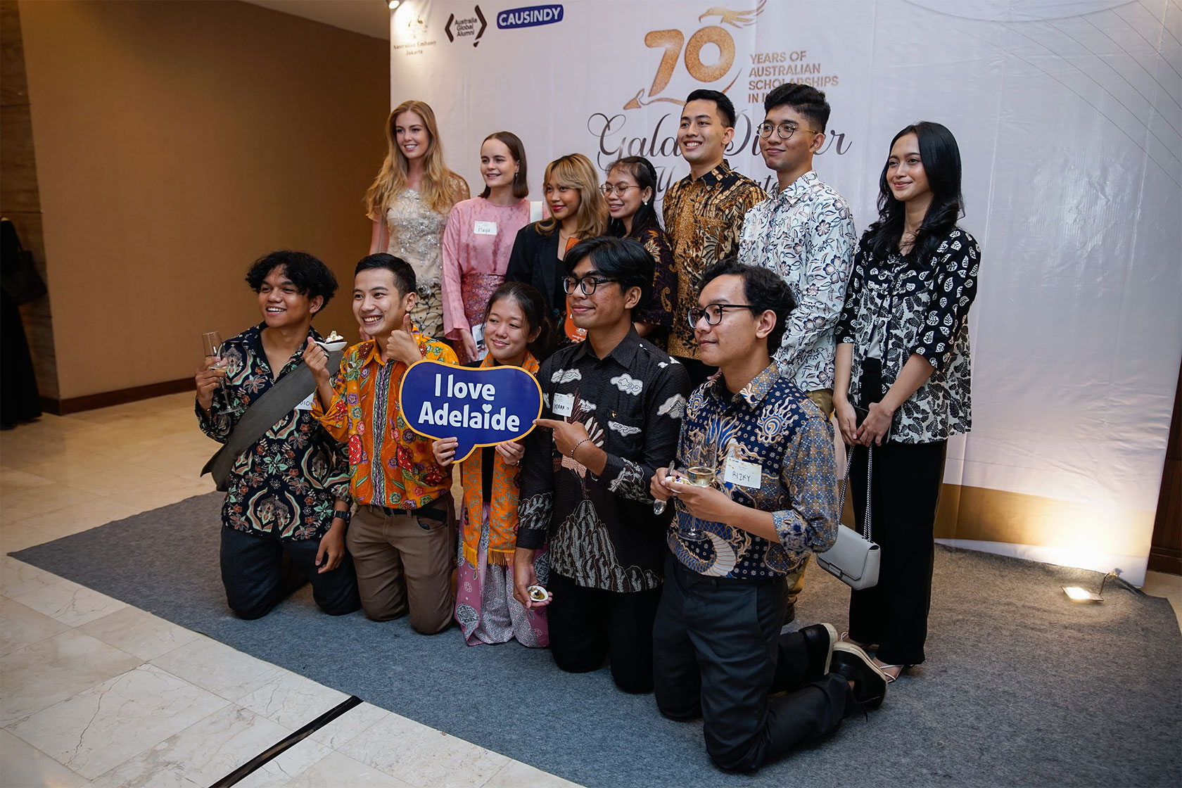 A group of Australian alumni cherish memories at the photo booth.