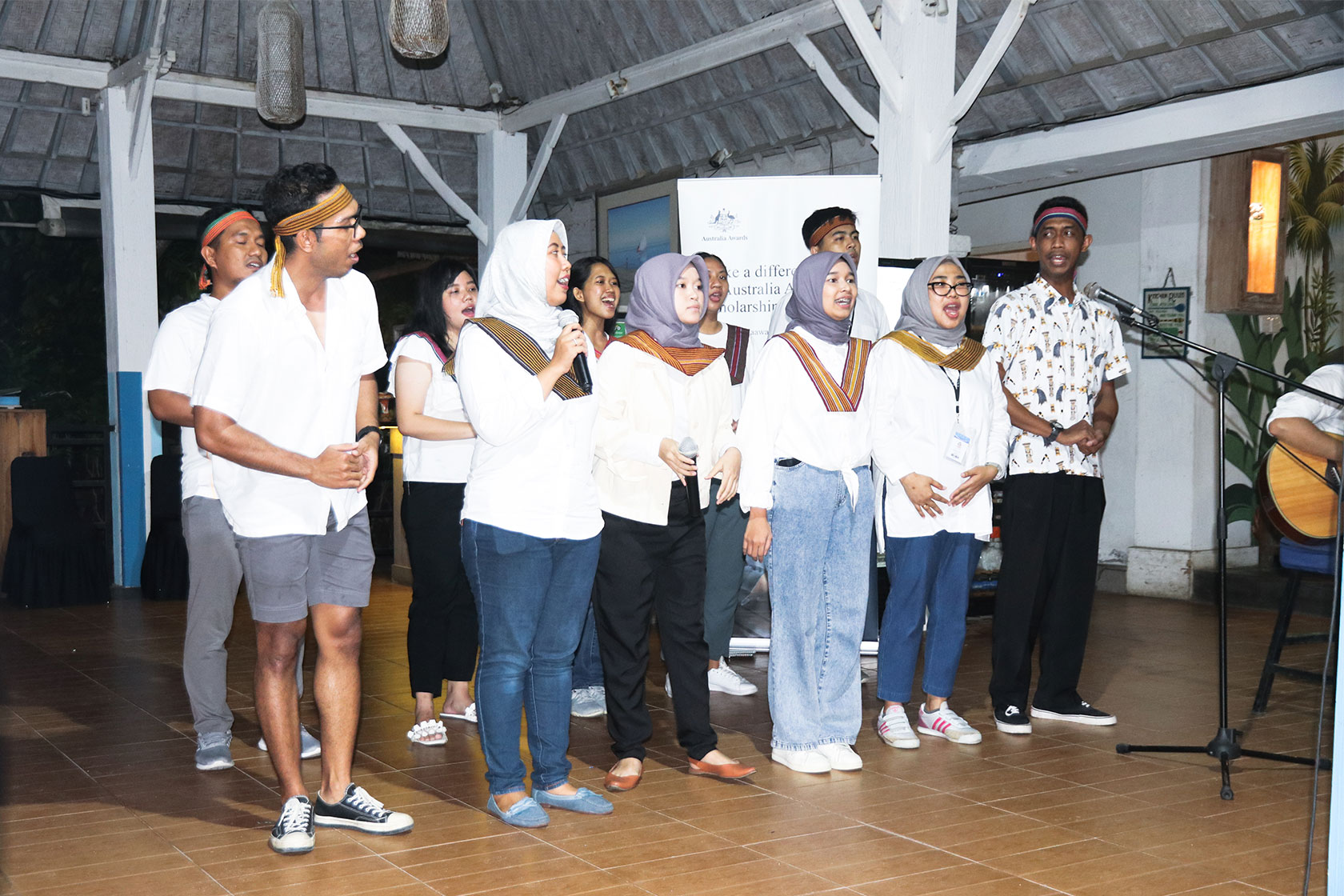 A group of Australia Awards scholars perform at the Pre-Departure Training Closing