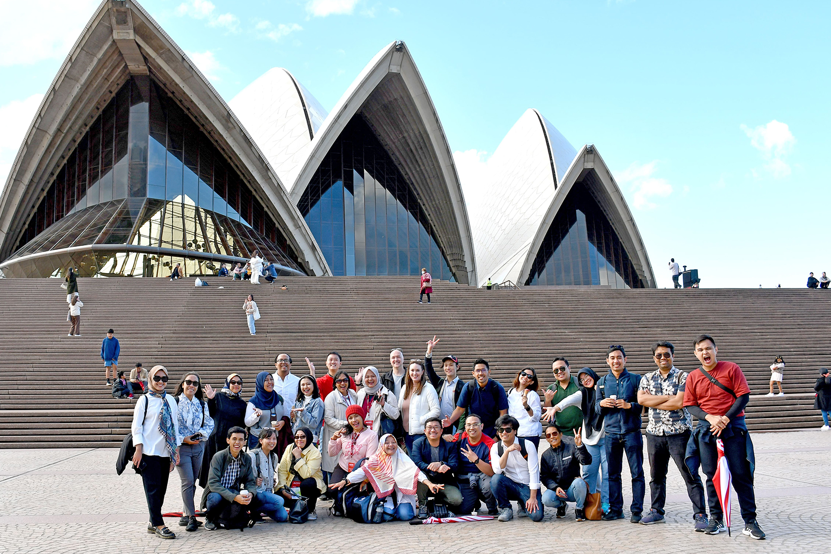 A group photo of the Public Transport Management Short Course participants in front of Sydney Opera House