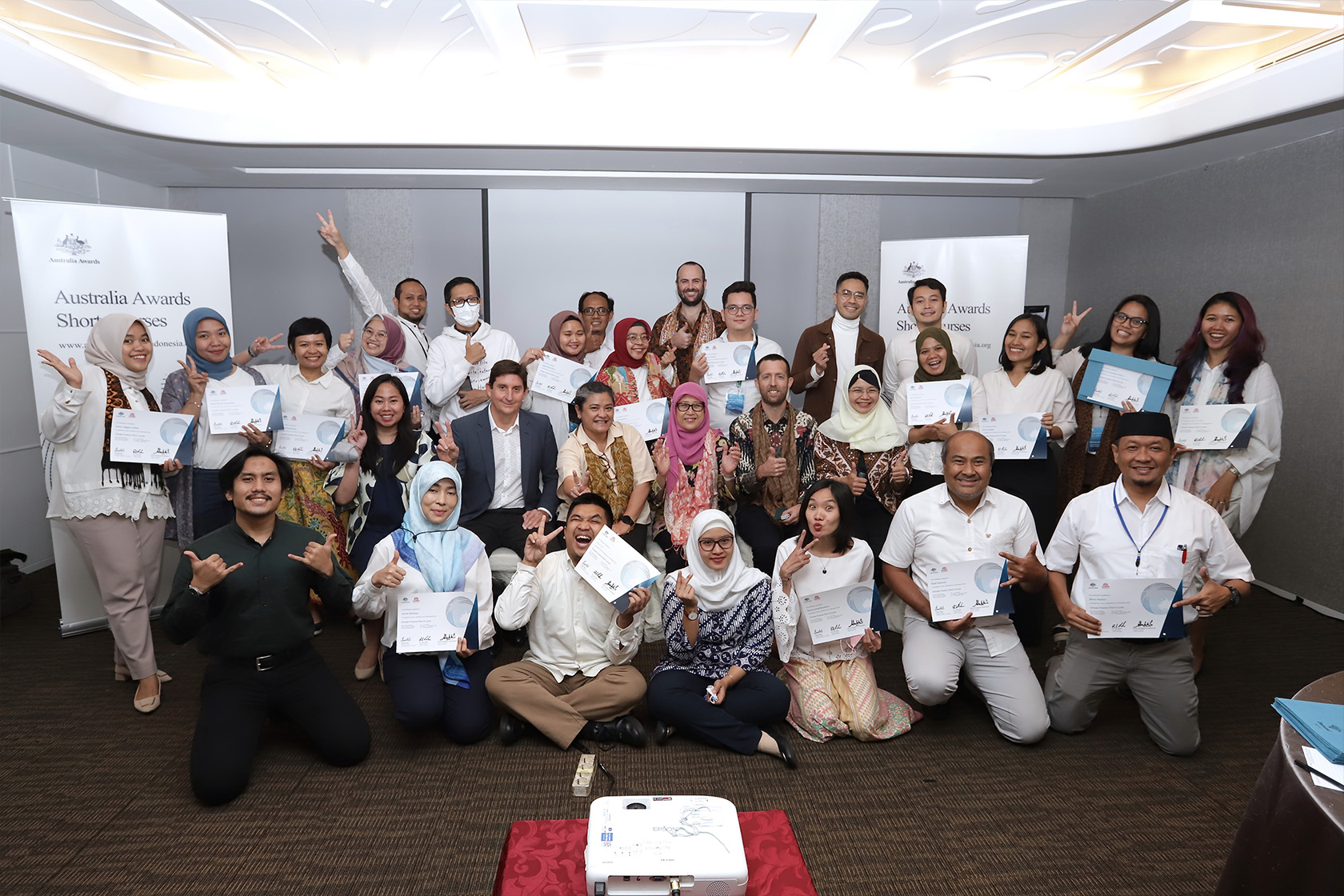 Participants of Australia Awards Short Course on Climate Finance take a group photo showing their certificate of completion