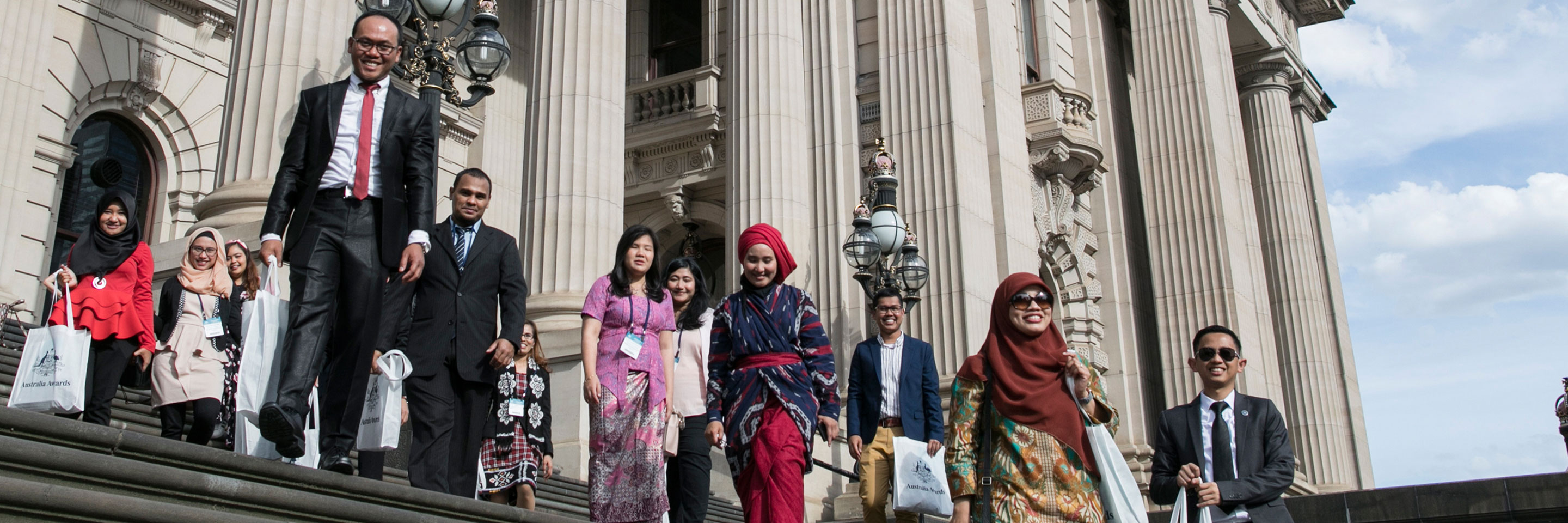 Australia Awards graduating scholars gather in front of the Parliament House in Melbourne for an end of year celebration before returning to Indonesia.
