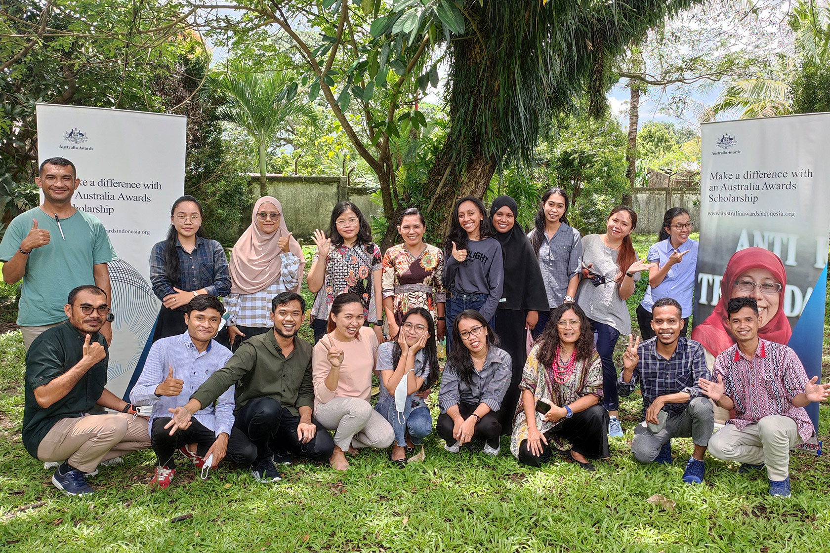 An outdoor group photo of ELTA participants in Maluku