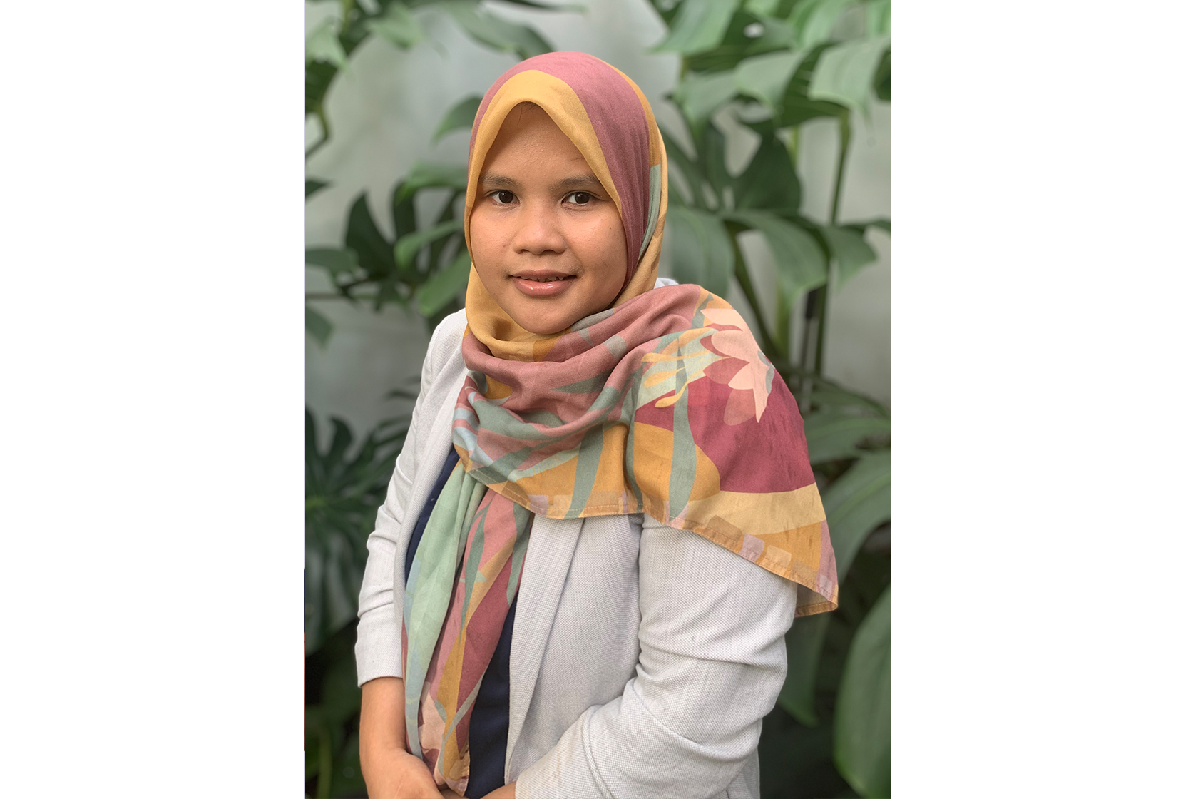 A headshot picture of Putri Rizki Yulianti, an Australia Awards Split-Site Master Program alumna