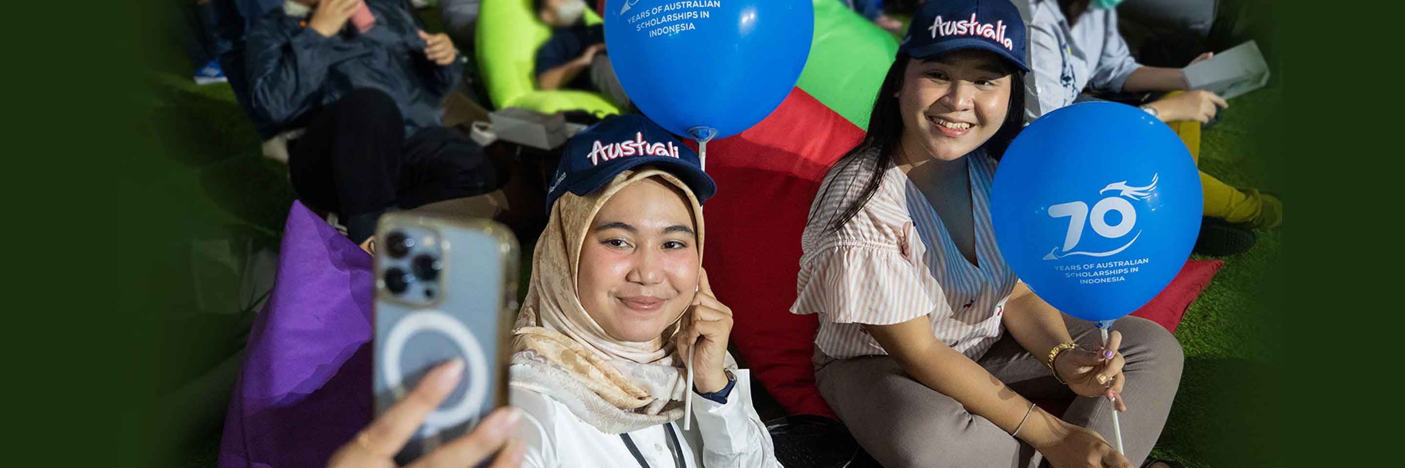 The alumni joyfully seized the moment, commemorating the occasion by taking a delightful wefie during the auspicious launch of the "70 Years of Australian Scholarships in Indonesia" campaign.